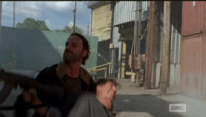 ...and grabs the shooter's gun...mmm hmmm, that's right, Rick Grimes.