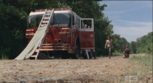 Her voice breaking slightly, Maggie slams the fire truck door shut, and walks away, telling Abraham that, 