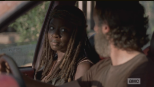 at the gate 5 rick looks at michonne