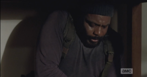tyreese sweating, looking at his wound